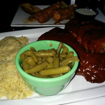 Bradshaw Social House - Full rack of ribs with green beans and rice - American Near Me - Charlotte, North Carolina Bradshaw Social House - Full rack of ribs with green beans and rice - American Near Me - Charlotte, North Carolina
