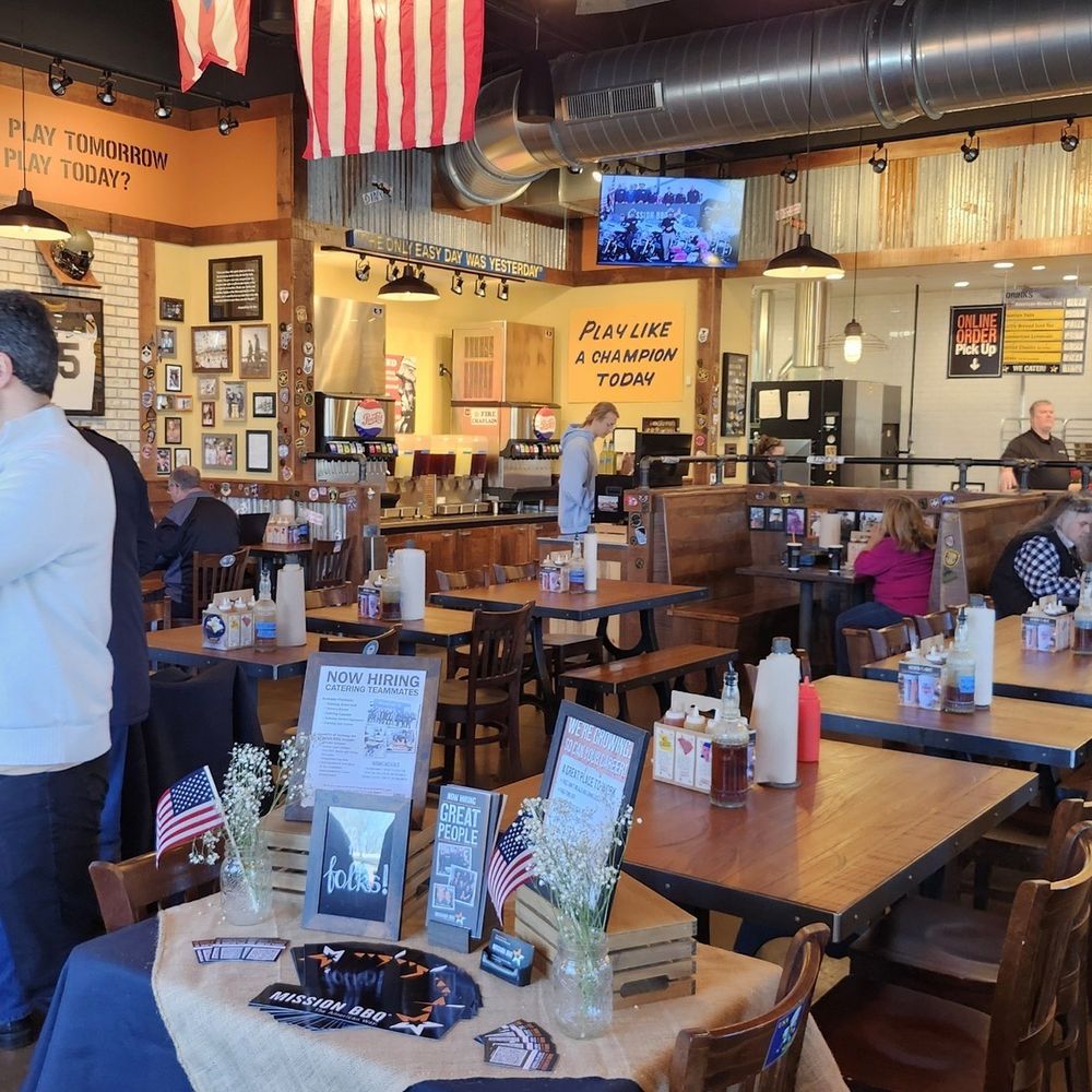 From the entrance in a corner. To the left out of sight is a wall full of booth seating. From the entrance in a corner. To the left out of sight is a wall full of booth seating.