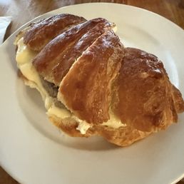 Homemade croissant, sausage, egg, and cheese breakfast sandwich Homemade croissant, sausage, egg, and cheese breakfast sandwich