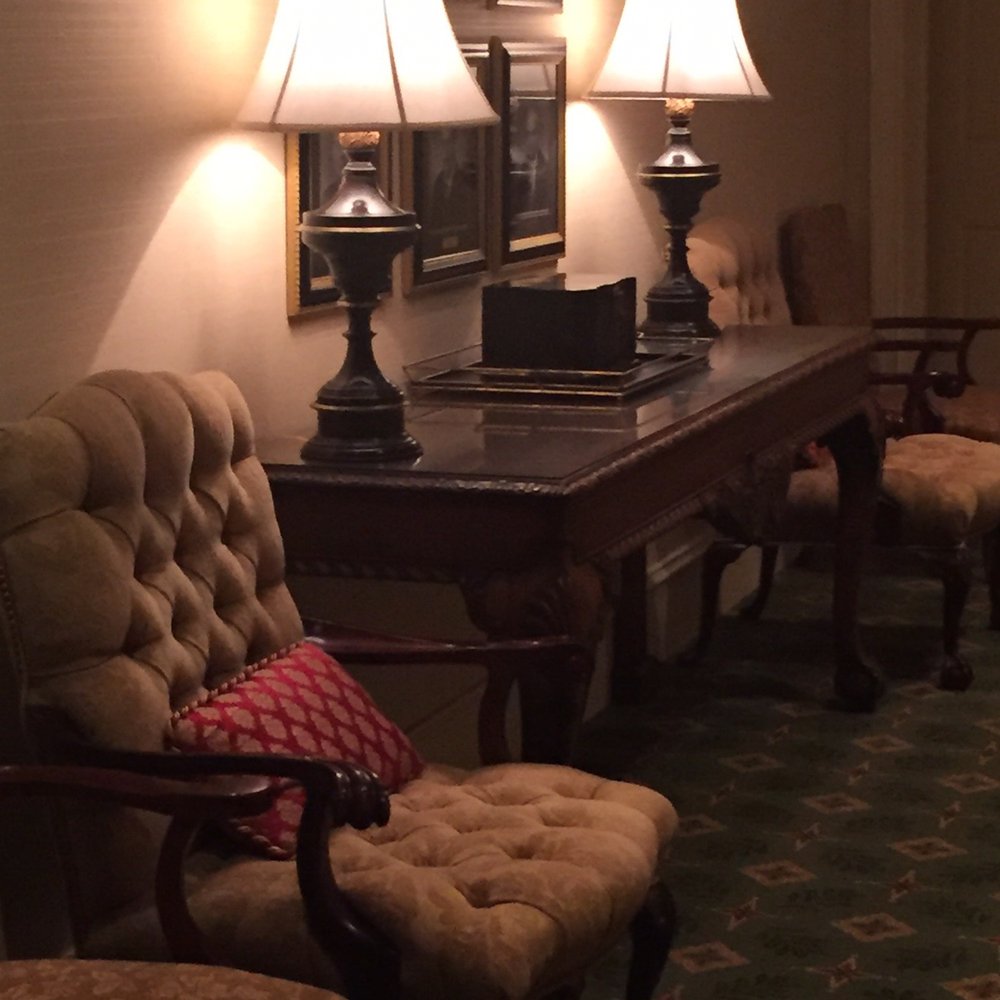 a row of chairs in a hotel lobby a row of chairs in a hotel lobby