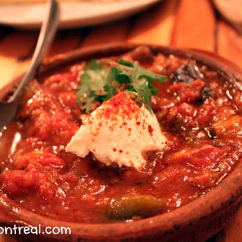 KazaMaza - Mousaqa'a: Fried eggplant, peppers, onions, tomatoes simmered in tomato sauce, topped with yogurt cheese and coriander - Middle Eastern Near Me - Montreal, Quebec KazaMaza - Mousaqa'a: Fried eggplant, peppers, onions, tomatoes simmered in tomato sauce, topped with yogurt cheese and coriander - Middle Eastern Near Me - Montreal, Quebec