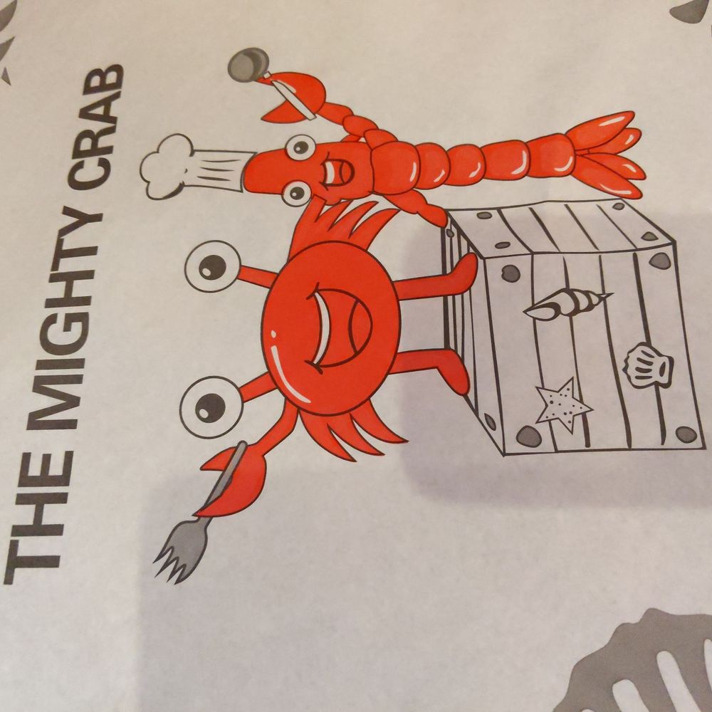 The Mighty Crab - Texarkana - a red crab holding a piece of luggage - Cajun/Creole Near Me - Texarkana, Texas The Mighty Crab - Texarkana - a red crab holding a piece of luggage - Cajun/Creole Near Me - Texarkana, Texas