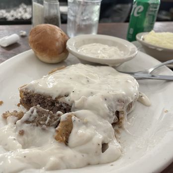 The Whistle Stop Cafe - Country fried steak and gravy with mashed potatoes and a roll. - American Near Me - Juliette, Georgia