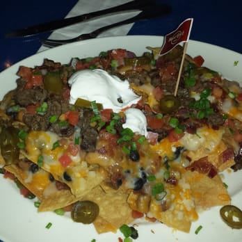 Hard Rock Cafe - the nachos, not youe typical starter size, more like an entree! soo good w/ all the toppings & gave a side of guacamole dip! - Burgers Near Me - Honolulu, Hawaii Hard Rock Cafe - the nachos, not youe typical starter size, more like an entree! soo good w/ all the toppings & gave a side of guacamole dip! - Burgers Near Me - Honolulu, Hawaii