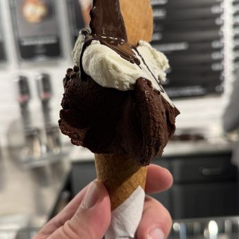 Come Il Latte - This is the prize, Sour Cherry Chocolate, cone with cream, chocolate drizzled with a cookie!  That how you order it - Gelato Near Me - Rome, RM