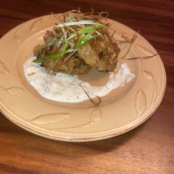 Blue Bowie Personal Chefs - Crab cakes topped with leeks, accompanied by a dill sauce - Personal Chefs Near Me