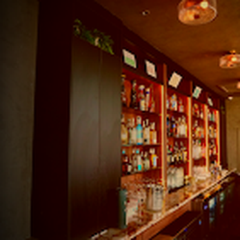 Nowhere Lounge - a long bar with lots of bottles of liquor - Lounges Near Me - McAllen, Texas Nowhere Lounge - a long bar with lots of bottles of liquor - Lounges Near Me - McAllen, Texas