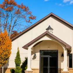 Capriotti's Palazzo - Elegant event venue entrance featuring modern architecture, a welcoming covered entryway, and beautifully maintained landscap...