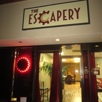 The Escapery - Outside at night. Look for the glowing red wheel cog. - Escape Games Near Me - Marietta, Georgia The Escapery - Outside at night. Look for the glowing red wheel cog. - Escape Games Near Me - Marietta, Georgia