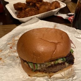 Large burger and an order of wings (dry) with Mango Habanero sauce (spicy) on the side Large burger and an order of wings (dry) with Mango Habanero sauce (spicy) on the side