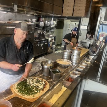 Brooklyn Boyz Pizza - This is the Owner Dennis making a pie and his assistant Alex making the big Baked Ziti - Pizza Near Me - Oceanside, California Brooklyn Boyz Pizza - This is the Owner Dennis making a pie and his assistant Alex making the big Baked Ziti - Pizza Near Me - Oceanside, California