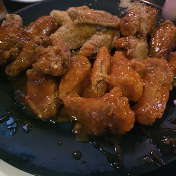 Two Parrots Bar & Grill - a plate of chicken wings - Breakfast & Brunch Near Me - Vancouver, British Columbia Two Parrots Bar & Grill - a plate of chicken wings - Breakfast & Brunch Near Me - Vancouver, British Columbia
