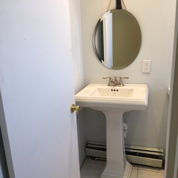 Mass Remodelers - a white pedestal sink and mirror - Pool & Hot Tub Service Near Me - Eugene, Oregon Mass Remodelers - a white pedestal sink and mirror - Pool & Hot Tub Service Near Me - Eugene, Oregon