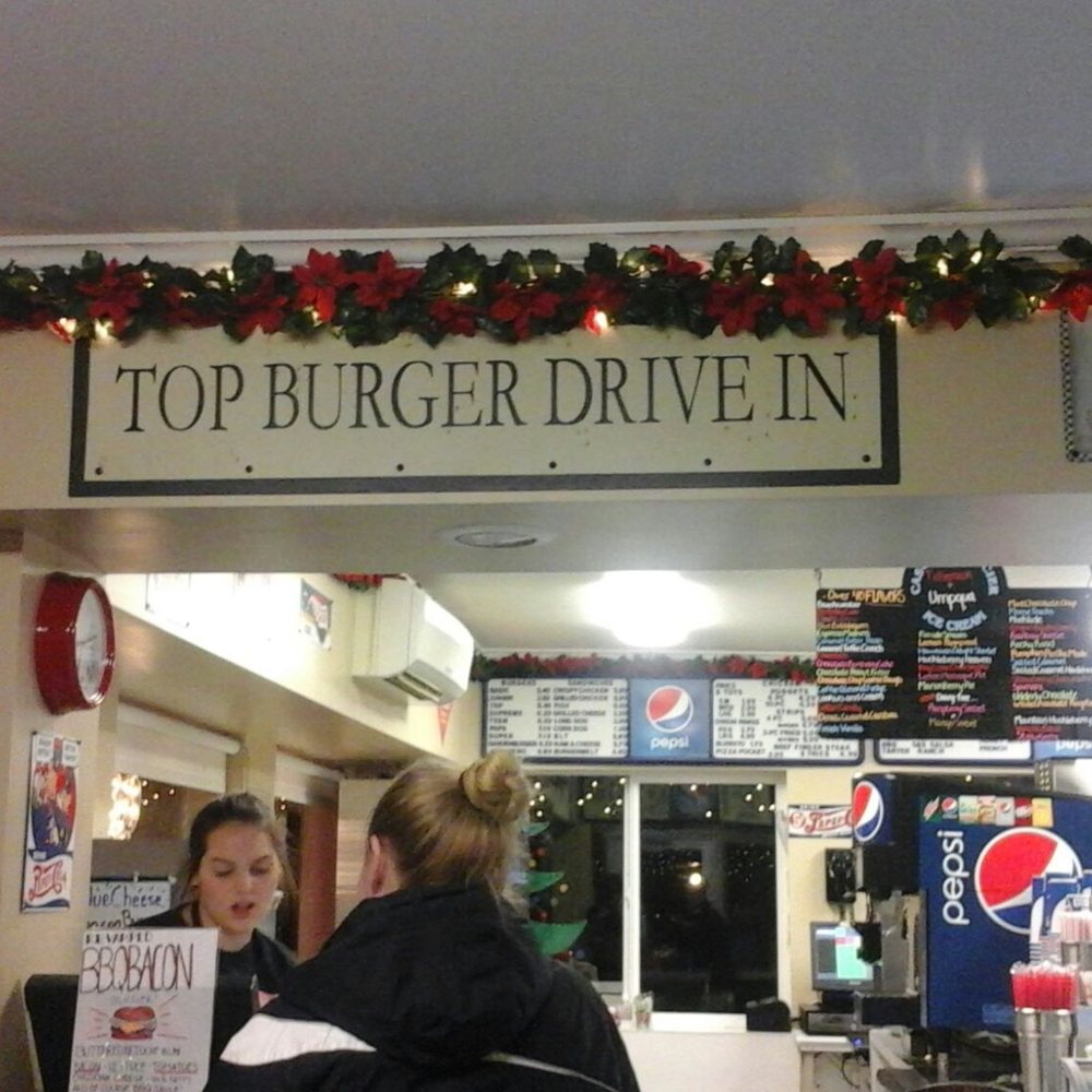Top Burger - Top Burger Drive-In sign above the front counter with pretty Christmas decorations - Burgers Near Me - Camas, Washington Top Burger - Top Burger Drive-In sign above the front counter with pretty Christmas decorations - Burgers Near Me - Camas, Washington