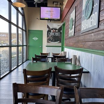 Wingstop - Seating area by the windows - Chicken Wings Near Me - Reno, Nevada