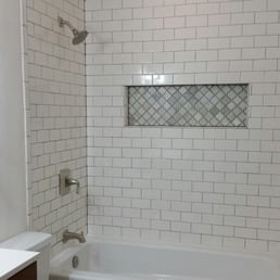 Matt installed the tiles, recessed shelf, and new jetted tub Matt installed the tiles, recessed shelf, and new jetted tub