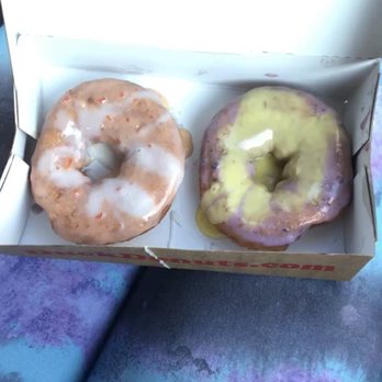 Duck Donuts - Orange Glaze with Vanilla drizzle on left and Blueberry Glaze with Lemon drizzle on right - Donuts Near Me - Alexandria, Virginia