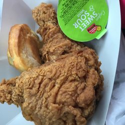 Two piece fried chicken with a biscuit and sauce for $3.19.