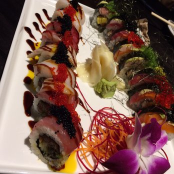 Kizuna - The magnificent presentation of the "Tuna All Day" (left) & "Vegas Strip" with seaweed garnishments (right). - Sushi Bars Near Me - Vienna, Virginia Kizuna - The magnificent presentation of the "Tuna All Day" (left) & "Vegas Strip" with seaweed garnishments (right). - Sushi Bars Near Me - Vienna, Virginia