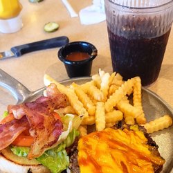 Iron Skillet - Skillet bacon cheeseburger. American cheese bacon lettuce tomato add a little mustard and Heinz 57 sauce. 57 for the fries too. Diet Pepsi