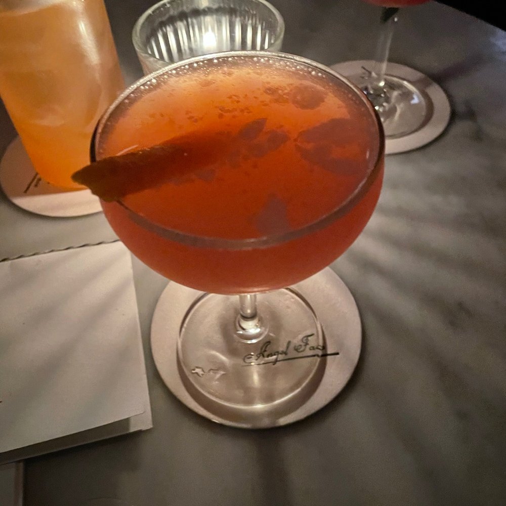two cocktails on a table two cocktails on a table