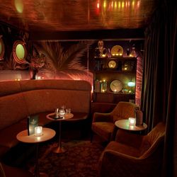 Green Lady Cocktail Room - Booth seating near the entry