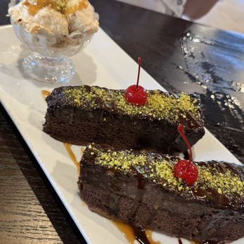 The Olives Branch - Pistachio Chocolate Fudge Cake with ice cream - Mediterranean Near Me - San Juan Capistrano, California The Olives Branch - Pistachio Chocolate Fudge Cake with ice cream - Mediterranean Near Me - San Juan Capistrano, California
