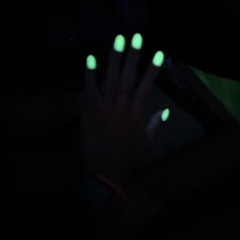 XOXO Nail Bar - Neon yellow dip powder nails glowing under a blacklight - Nail Salons Near Me - Irvine, California XOXO Nail Bar - Neon yellow dip powder nails glowing under a blacklight - Nail Salons Near Me - Irvine, California