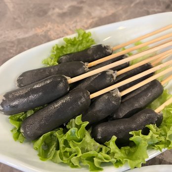 Chengdu Memory - Some sort of fish cake on a stick.  It looks scary to me.  I didn't care for the color  but fam said it's delicious.  Meh! - Hot Pot Near Me - Seattle, Washington