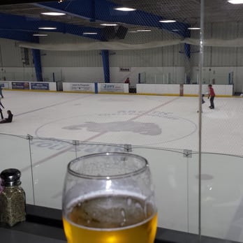 Arctic Breakaway - a glass of beer on a table in front of a hockey rink - Sports Bars Near Me - Chelsea, Michigan Arctic Breakaway - a glass of beer on a table in front of a hockey rink - Sports Bars Near Me - Chelsea, Michigan