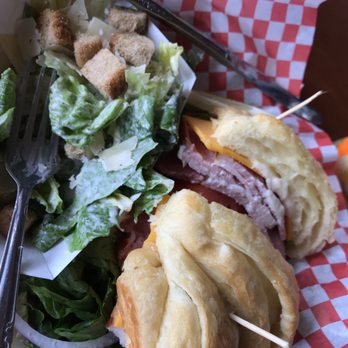 Orcas Hotel - Ham and cheese croissant with Caesar salad - Hotels Near Me - Orcas, Washington
