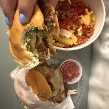 Shake Shack - ShackBurger top, black truffle burger bottom. Double down fries in back. - Burgers Near Me - Las Vegas, Nevada Shake Shack - ShackBurger top, black truffle burger bottom. Double down fries in back. - Burgers Near Me - Las Vegas, Nevada
