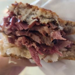 Hot pastrami on rye with kraut, thousand island and grilled.