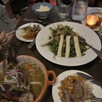 Tambo 22 - Lamb Shank and Arugula Salad - Peruvian Near Me - Chelsea, Massachusetts Tambo 22 - Lamb Shank and Arugula Salad - Peruvian Near Me - Chelsea, Massachusetts