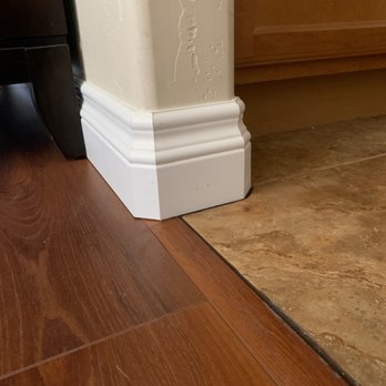 Atomic Construction - Rounded corner tri-cut.  Eric cut former baseboard without breaking the tile. - Flooring Near Me - Phoenix, Arizona