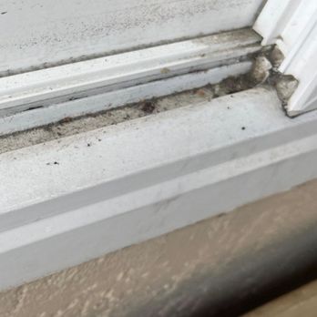 Alaska Solutions - dirty window with years of accumulated dirt - Window Washing Near Me
