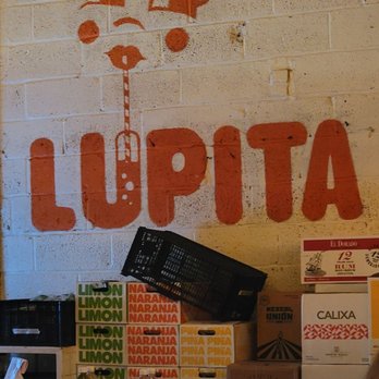 Tacombi - a restaurant with a sign that says lupita - Mexican Near Me - New York, New York Tacombi - a restaurant with a sign that says lupita - Mexican Near Me - New York, New York