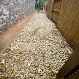 River rock added to the side of our home by Daniel Flores of Grace Landscaping and tree service.