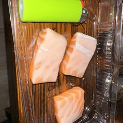 Ninja sushi - Salmon sashimi next to an XL lighter