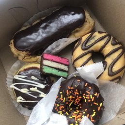 Eclair, hazelnut filled donut, chocolate cake donut, mini cheesecake, rainbow cookie ($11.75 total, October 2020)