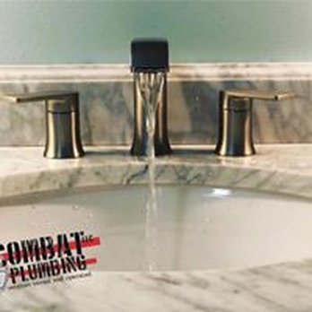 Combat Plumbing - a sink with a faucet running out of it - Plumbing Near Me