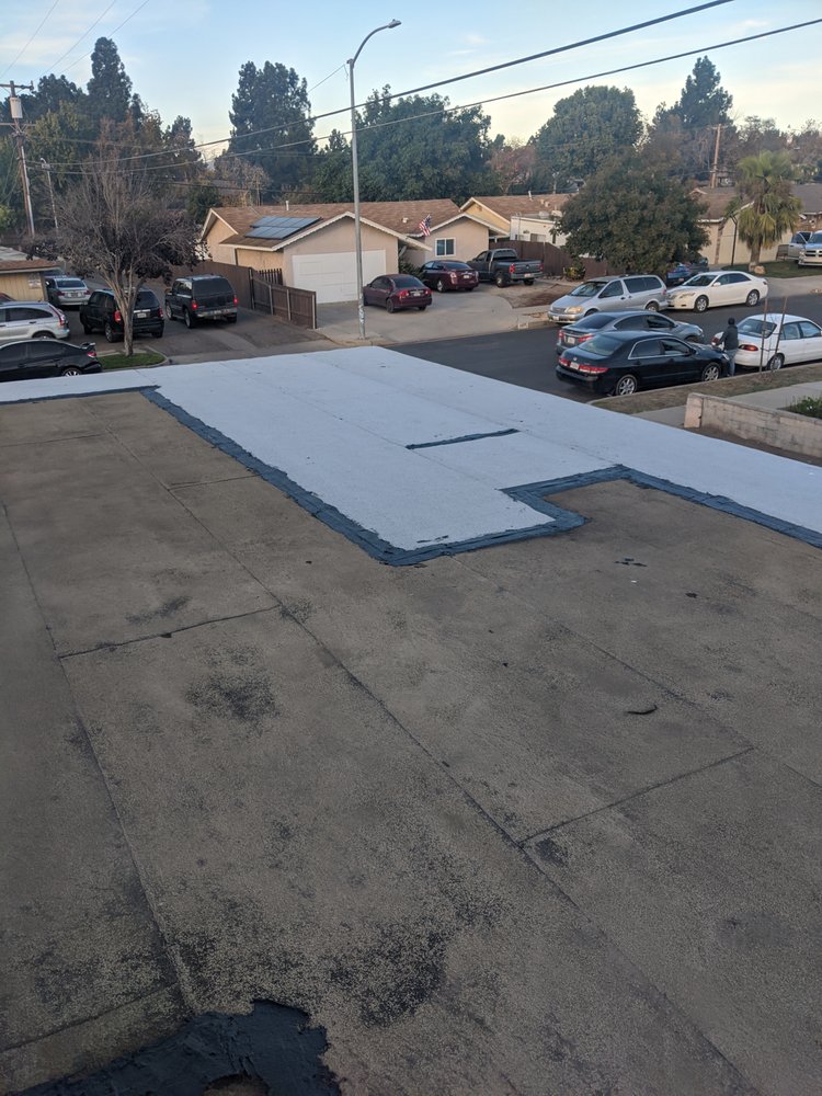 Slide of Tom's Roofing Services