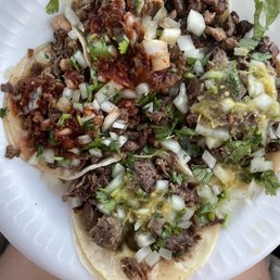 a person holding a plate of food a person holding a plate of food