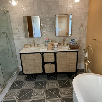 Regal Property Services - a bathroom with a bathtub, sink, and shower - General Contractors Near Me Regal Property Services - a bathroom with a bathtub, sink, and shower - General Contractors Near Me