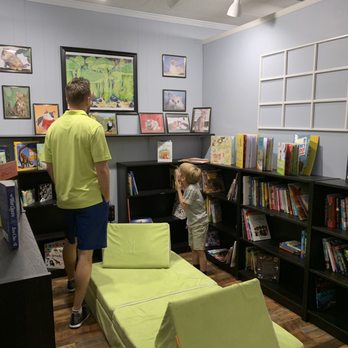 Main Street Reads - Children's Corner--having fun with the talking parrot - Bookstores Near Me - Summerville, South Carolina