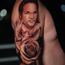 My dad's portrait with a dove and rose in a tattoo!