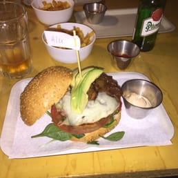 My monster veggie burger with fries and a beer My monster veggie burger with fries and a beer
