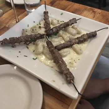Monica's Trattoria - The lamb skewers with gnocchi - Italian Near Me - Boston, Massachusetts Monica's Trattoria - The lamb skewers with gnocchi - Italian Near Me - Boston, Massachusetts