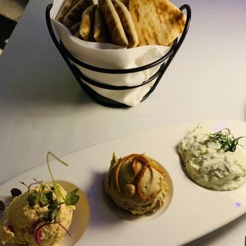 Nerai - Pita trio: with spicy feta, hummus, and tziziki - Greek Near Me - New York, New York Nerai - Pita trio: with spicy feta, hummus, and tziziki - Greek Near Me - New York, New York