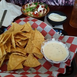 66 Chuck Wagon - Fresh cooked chips w/green chili white queso. Side salad w/extra tomato.
